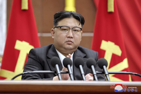 In this photo provided by the North Korean government, North Korean leader Kim Jong Un delivers a speech during a year-end plenary meeting of the ruling Workers’ Party, which was held between Dec. 26, and Dec. 30, 2023, in Pyongyang, North Korea. Independent journalists were not given access to cover the event depicted in this image distributed by the North Korean government. The content of this image is as provided and cannot be independently verified. Korean language watermark on image as provided by source reads: 