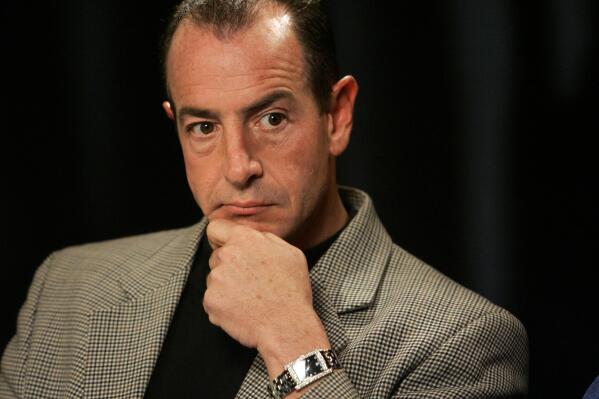 FILE - In this Wednesday, Oct. 24, 2007, file photo, Michael Lohan is interviewed in New York. The estranged father of actress Lindsay Lohan was arrested Friday, April 23, 2021, on charges that he illegally took kickbacks for referring patients to a substance abuse treatment center. The Palm Beach Post reports that 60-year-old Michael Lohan was booked into jail on five counts of patient brokering and one count of conspiracy to commit patient brokering. (AP Photo/Richard Drew, File)
