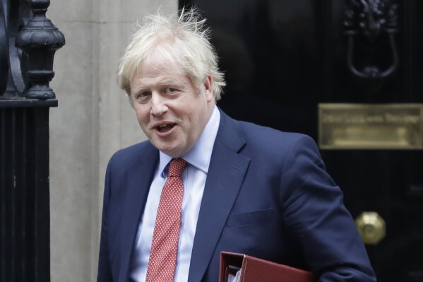 Britain's Prime Minister Boris Johnson leaves 10 Downing Street to attend the weekley session of Prime Ministers Questions in Parliament in London, Wednesday, Jan. 22, 2020. (AP Photo/Kirsty Wigglesworth)