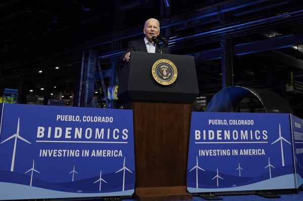 FILE - President Joe Biden speaks about investing in clean energy manufacturing at CS Wind, the largest wind tower manufacturer in the world, Wednesday, Nov. 29, 2023, in Pueblo, Colo. Biden goes into next year's election with a vexing challenge: Just as the U.S. economy is getting stronger, people are still feeling horrible about it. Pollsters and economists say there has never been as wide a gap between the underlying health of the economy and public perception. (AP Photo/Andrew Harnik, File)