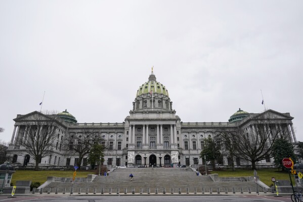 FILE - The Pennsylvania Capitol is seen, Feb. 21, 2023, in Harrisburg, Pa. Public school advocates in Pennsylvania are criticizing publicly funded programs that pay tuition at private and religious schools. They say many such schools discriminate by cherry-picking which students are able to attend. School funding is an unresolved area of contention as the House and Senate return to session on Monday, Dec. 11. (AP Photo/Matt Rourke, File)