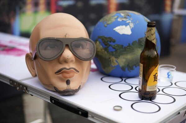 A Pitbull mask on a beer pong table on Monday, June 9, 2025, in London. (Photo by Scott A Garfitt/Invision/AP)