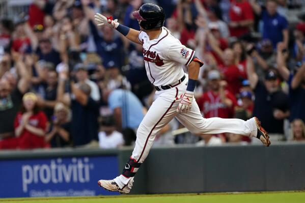 Atlanta Braves third baseman Austin Riley gestures as he rounds the bases after hitting a two-run home run in the first inning of a baseball game against the New York Mets Thursday, July 1, 2021, in Atlanta. (AP Photo/John Bazemore)