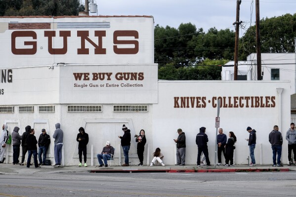 FILE - People wait in line to enter a gun store in Culver City, Calif., on March 15, 2020. A federal appeals court on Wednesday, Sept. 13, 2023, opened the way to block a California law that bans gun ads aimed at children, saying it went too far in restricting lawful speech. (AP Photo/Ringo H.W. Chiu, File)