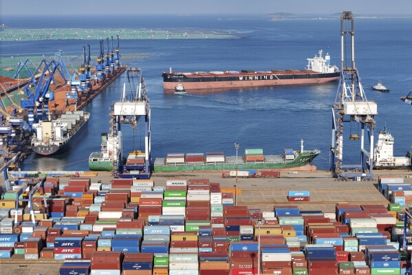 FILE - Containers wait to be transported on a dockyard in Yantai in eastern China's Shandong province on Aug. 6, 2023. China’s exports declined at a slower pace in August, even as the world’s second biggest economy remains under pressure amid weaker demand both domestically and abroad, according to customs data Thursday, Sept. 7, 2023. (Chinatopix via AP, File)