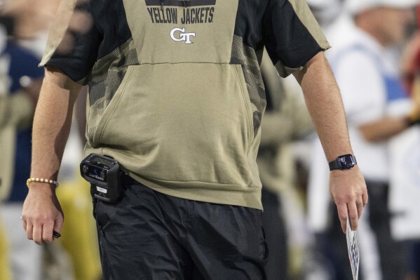 Georgia Tech coach Brent Key watches during the first half of the team's NCAA college football game against Syracuse, Saturday, Nov. 18, 2023, in Atlanta. (AP Photo/Hakim Wright Sr.)