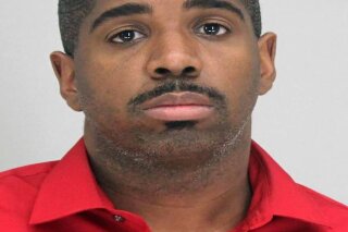 This photo provided by the Dallas County Sheriff's Office shows Bryan Riser. Authorities say Riser, a Dallas police officer, has been arrested on two counts of capital murder, more than a year and a half after a man told investigators that he kidnapped and killed two people at the officer’s instruction in 2017. (Dallas County Sheriff's Office via AP)