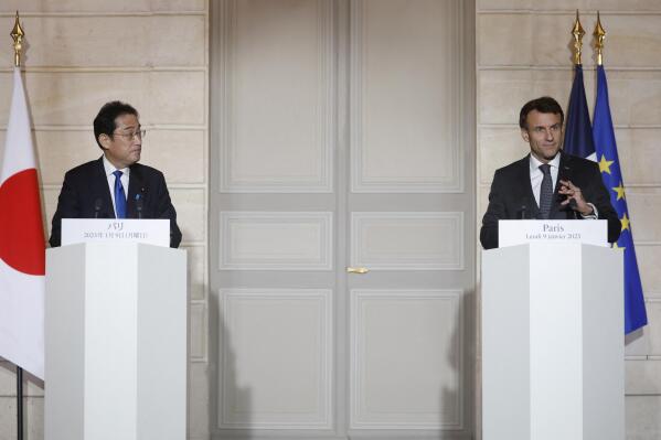 French President Emmanuel Macron and Japan's Prime Minister Fumio Kishida deliver a joint statement at the Elysee Palace in Paris, Monday, Jan. 9, 2023. Japanese Prime Minister Fumio Kishida is starting Monday a weeklong trip to Europe and North America Monday in Paris where he will hold talks with French President Emmanuel Macron on key global issues, including the war in Ukraine. (Gonzalo Fuentes/Pool via AP)