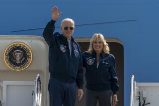 U.S. President Joe Biden waves as first lady Jill Biden watches standing at the top of the steps of Air Force One before boarding at Andrews Air Force Base, Md., Saturday, Sept. 17, 2022. President Biden said during and interview broadcasted on Sunday, Sept. 18, 2022, that U.S. forces would defend Taiwan if China tries to invade the self-ruled island claimed by Beijing as part of its territory, adding to displays of official American support for the island democracy in the face of Chinese intimidation. (AP Photo/Gemunu Amarasinghe, File)