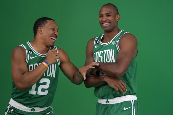 Boston Celtics forward Grant Williams, left, jokes with center Al Horford, right, as the NBA basketball players stand for photos during the team's Media Day, Monday, Sept. 26, 2022, in Canton, Mass. (AP Photo/Steven Senne)