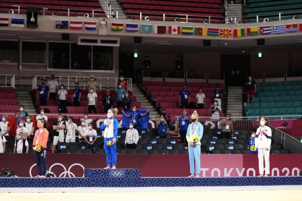From left, silver medalist Funa Tonaki of Japan, gold medalist Distria Krasniqi of Kosovo, and bronze medalists Daria Bilodid of Ukraine and Urantsetseg Munkhbat of Mongolia stand during the medal ceremony for women's -48kg judo at the 2020 Summer Olympics, Saturday, July 24, 2021, in Tokyo, Japan. (AP Photo/Vincent Thian)