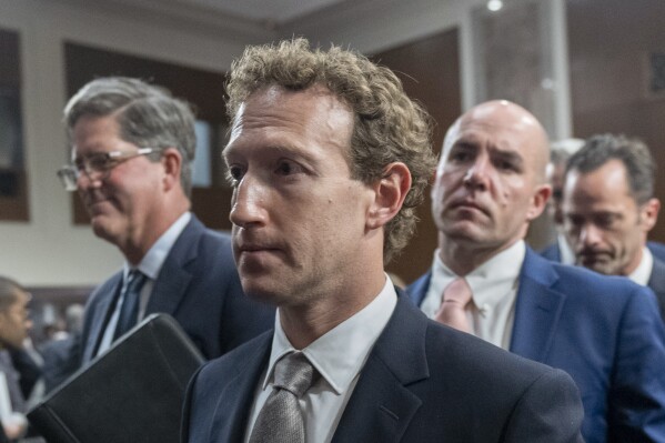 File - Meta CEO Mark Zuckerberg leaves a Senate Judiciary Committee hearing on online child safety, Jan. 31, 2024, on Capitol Hill in Washington. Meta releases results on Thursday, Feb. 1, 2024. (AP Photo/Manuel Balce Ceneta, File)