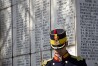 A honor guard soldier stands during a ceremony  at a Jewish cemetery in Bucharest, Romania, Friday, Feb. 24, 2012, next to a monument bearing the names of Jews killed 70 years ago when the SS Struma, the ship they were on as refugees on the way to Palestine, was sunk by a Soviet torpedo in the Black Sea leading to the death of all but one of the 779 people on board. (AP Photo/Vadim Ghirda)