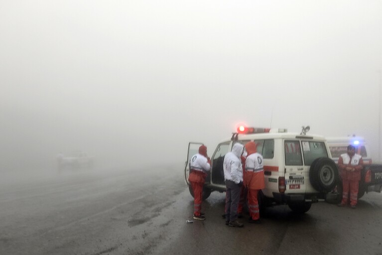 In this photo provided by Moj News Agency, rescue teams are seen near the site of the incident of the helicopter carrying Iranian President Ebrahim Raisi in Varzaghan in northwestern Iran, Sunday, May 19, 2024. (Azin Haghighi, Moj News Agency via AP)