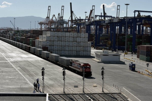 FILE - A freight train line at the port of Piraeus during its inauguration on June 20, 2014. Greece Monday Feb. 26, 2024 formally agreed to participate in and lead a European Union maritime security operation in the Red Sea, to protect commercial shipping from attacks by Houthi militants in Yemen. Greece, a major commercial shipping power, has been directly affected by the Houthi attacks. The port of Piraeus, near Athens, reported a 12.7% drop in activity at its container terminal in January, on an annual basis. (AP Photo/Louisa Gouliamaki, Pool, File)