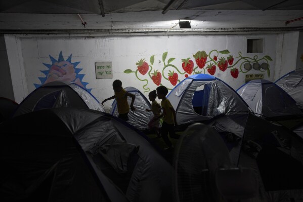 Children play in a public bomb shelter in Tel Aviv, Israel, on Saturday, June 21, 2025, amid concerns over potential Iranian missile attacks. (AP Photo/Oded Balilty)