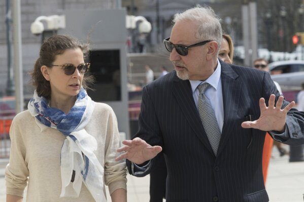 
              Clare Bronfman, left, arrives at Federal court with her attorney Mark Geragos in the Brooklyn borough of New York, Friday, April 19, 2019. Bronfman has pleaded guilty to charges implicating her in a sex-trafficking conspiracy case against an upstate New York self-help group. (AP Photo/Mary Altaffer)
            