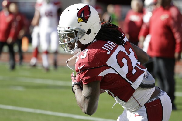 Arizona Cardinals running back Chris Johnson warms up before an NFL football game against the San Francisco 49ers in Santa Clara, Calif., Nov. 29, 2015. Johnson watches football whenever possible. He also knows talent when he sees it. Now the man nicknamed CJ2K for being among the NFL’s exclusive group of running backs with a 2,000-yard rushing season is ready to see if scouting is his way to stay involved with the league. (AP Photo/Marcio Jose Sanchez, file)