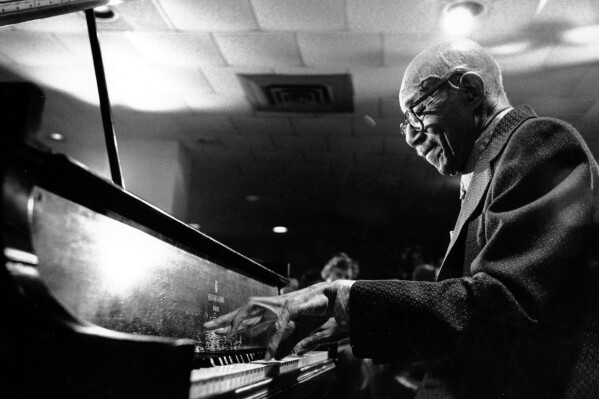 Veteran jazz pianist Eubie Blake performs during a suprise party for his 93rd birthday at New York's Waldorf Astoria Hotel on Feb. 7, 1976.  (AP Photo/Ray Stubblebine)