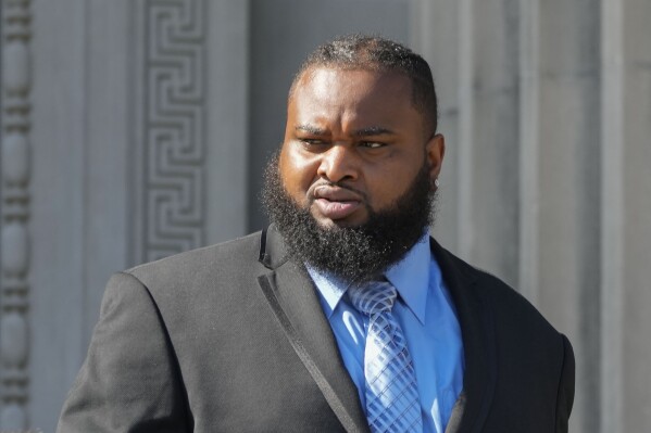 Cardell Hayes leaves Orleans Parish Criminal District Court in New Orleans, Monday, Sept. 18, 2023, after a hearing regarding his retrial for shooting former NFL star Will Smith. Hayes fatally shot Smith, who had retired from the New Orleans Saints, and wounded his wife, in a confrontation after a 2016 traffic crash. (AP Photo/Gerald Herbert)