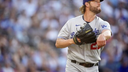 Los Angeles Dodgers starting pitcher Clayton Kershaw throws to first base to put out Colorado Rockies' C.J. Cron in the second inning of a baseball game Tuesday, June 27, 2023, in Denver. (AP Photo/David Zalubowski)