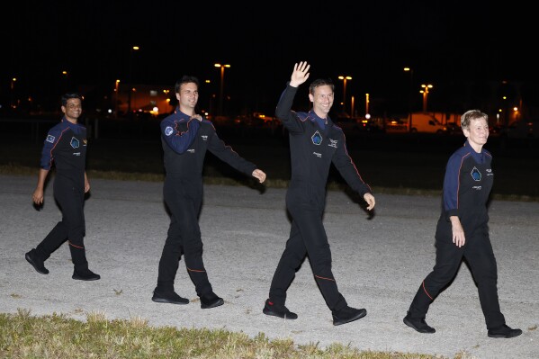 SpaceX Falcon 9 crew, left to right, Shubhanshu Shukla of the Indian Space Research Organization, Tibor Kapu of Hungary, Slawosz Uznanski-Wisniewski of Poland, and commander Peggy Whitson before departing for pad 39A for a mission to the International Space Station at the Kennedy Space Center in Cape Canaveral, Fla., Tuesday, June 24, 2025. (AP Photo/Terry Renna)