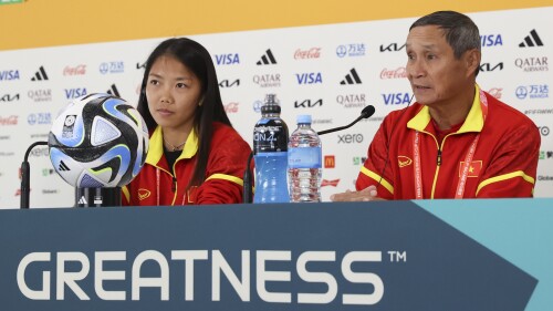 Vietnam captain Huynh Nhu and team coach Mai Duc Chung speak at a press conference a day ahead of the team's first match in the Women's World Cup in Auckland, New Zealand, Friday, July 21, 2023. Vietnam will play the United States on Saturday July 22. (AP Photo/Rafaela Pontes)