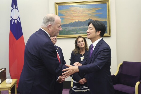 In this photo released by the Taiwan Presidential Office, U.S. Democratic Congressman Dan Kildee, left, meets with Taiwan President-elect and Vice President Lai Ching-te in Taipei, Taiwan on Tuesday, April 23, 2024. Kildee and Lisa McClain, secretary-general of the Republican Caucus of the U.S. House of Representatives jointly led a cross-party group of lawmakers to visit Taiwan from April 23 to 25 . Members also include Mark Alford, a member of the House Armed Services Committee. (Taiwan Presidential Office via AP)