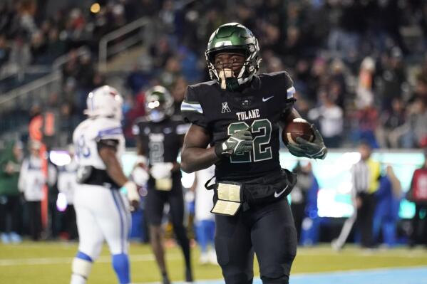 Tulane running back Tyjae Spears (22) scores a touchdown during the second half of an NCAA college football game against Southern Methodist in New Orleans, Thursday, Nov. 17, 2022. Tulane won 59-24. (AP Photo/Gerald Herbert)
