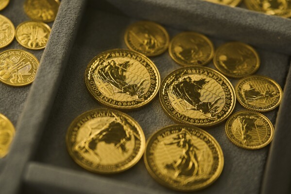 A collection of gold coins is displayed at a shop in the St. Vincent Jewelry Center in the Jewelry District of Los Angeles, Wednesday, April 30, 2025. (AP Photo/Jae C. Hong)