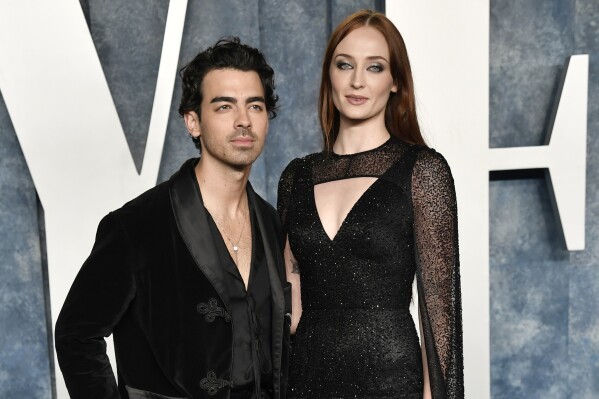 FILE - Joe Jonas, left, and Sophie Turner appear at the Vanity Fair Oscar Party on March 12, 2023, at the Wallis Annenberg Center in Beverly Hills, Calif. Jonas has filed for divorce from Turner after four years of marriage and two children. The 34-year-old Jonas Brothers singer filed to end his marriage with the 27-year-old star of “Game of Thrones” and “X-Men” actor on Tuesday, Sept. 5, 2023, in a Florida court. (Photo by Evan Agostini/Invision/AP, File)