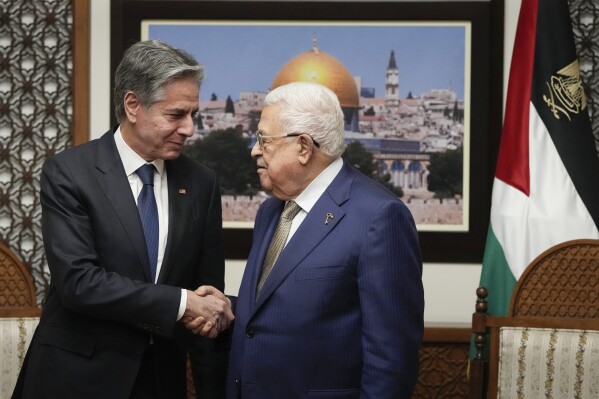 FILE - U.S. Secretary of State Antony Blinken, left, and Palestinian President Mahmoud Abbas shake hands during a meeting in the West Bank town of Ramallah, Wednesday, Feb. 7, 2024. As chances rise of a Joe Biden-Donald Trump rematch in the U.S. presidential election race, America’s allies are bracing for a bumpy ride. Palestinians and their supporters implore Biden to temper U.S. support for Israel as the civilian death toll from the war in Gaza climbs. But hard-liners in Israel argue the U.S. is already restraining the offensive too much. (AP Photo/Mark Schiefelbein, Pool, File)