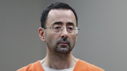 FILE - Disgraced former sports doctor Larry Nassar appears in court for a plea hearing, Nov. 22, 2017, in Lansing, Mich. Nassar was stabbed Sunday, July 9, 2023, in his cell at a federal penitentiary in Florida, out of view of surveillance cameras pointed at common areas and corridors. It’s the second time the ex-U.S. women’s gymnastics team doctor has been assaulted in federal custody while serving decades in prison for sexually abusing athletes. (AP Photo/Paul Sancya, File)