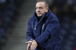 FILE - Feyenoord's head coach Dick Advocaat gestures during their Europa League group G soccer match against FC Porto at Dragao stadium in Porto, Portugal, Dec. 12, 2019. Dick Advocaat was hired Monday, Jan. 15, 2024, as coach of Curaçao's national soccer team ahead of the nation's opening World Cup qualifier in June. (AP Photo/Miguel Angelo Pereira, file)