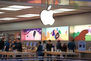 FILE - Customers shop in an Apple store in Pittsburgh Jan. 30, 2023. Apple reports their earnings on Thursday, May 4. (AP Photo/Gene J. Puskar, File)