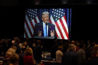 FILE - In this Monday, Aug. 24, 2020 file photo, a screen displays President Donald Trump as he speaks on stage during the first day of the Republican National Committee convention in Charlotte, N.C. On Monday, May 17, 2021, GOP officials announced that the former president will speak at the June 5, 2021 state convention dinner in Greenville. (AP Photo/Evan Vucci, File)