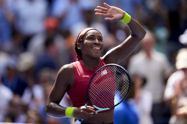 Coco Gauff, of the United States, reacts to the crowd after defeating Jelena Ostapenko, of Latvia, during the quarterfinals of the U.S. Open tennis championships, Tuesday, Sept. 5, 2023, in New York. (AP Photo/Manu Fernandez)