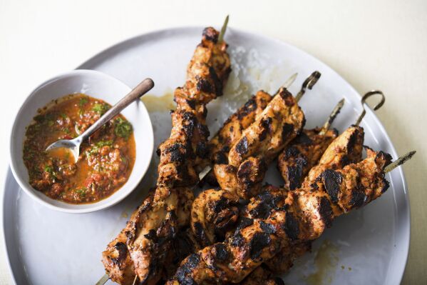 This image released by Milk Street shows a recipe for Turkish-style chicken kebabs. (Milk Street via AP)