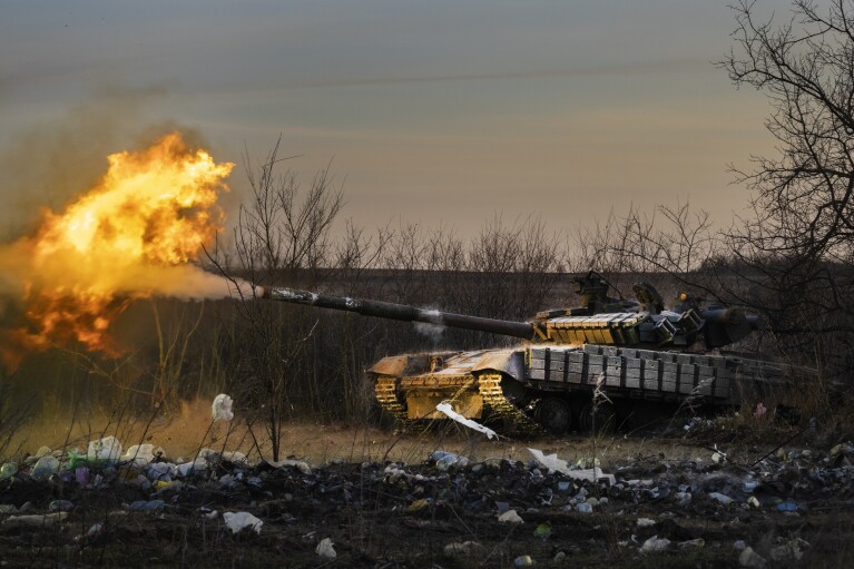 FILE - A Ukrainian tank of the 17th Tank Brigade fires at Russian positions in Chasiv Yar, the site of fierce battles with the Russian troops in the Donetsk region, Ukraine, Thursday, Feb. 29, 2024. (AP Photo/Efrem Lukatsky, File)