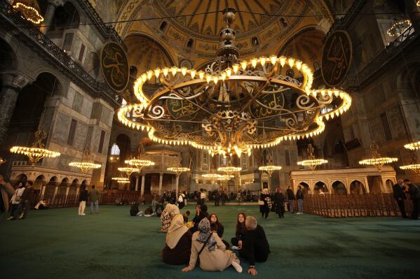 People visit Byzantine-era Hagia Sophia mosque in Istanbul, Turkey, Sunday, April 13, 2025. (AP Photo/Emrah Gurel)