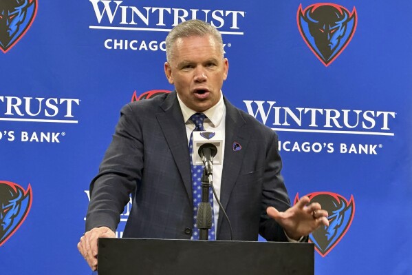 Chris Holtmann speaks after being introduced as the new NCAA college basketball head coach at DePaul University in Chicago Monday, March 18, 2024. (AP Photo/Andrew Seligman)