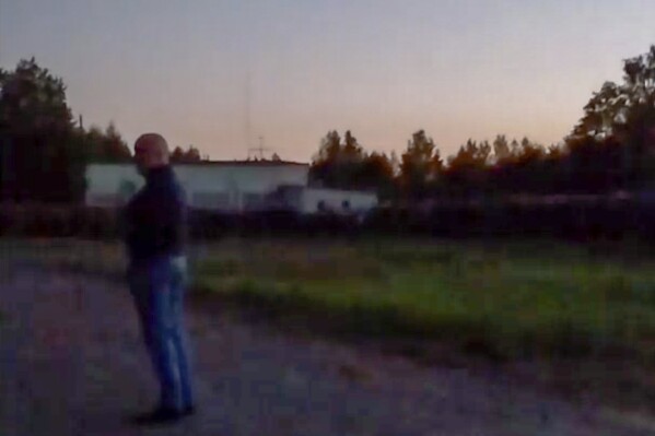 This image from video released Wednesday, July 19, 2023, appears to show Russian mercenary chief Yevgeny Prigozhin for the first time since he led a short-lived rebellion in June. The grainy video of him speaking to troops at a field camp purportedly in Belarus, was posted on a messaging app channel linked to Prigozhin's Wagner private military company. (AP Photo)