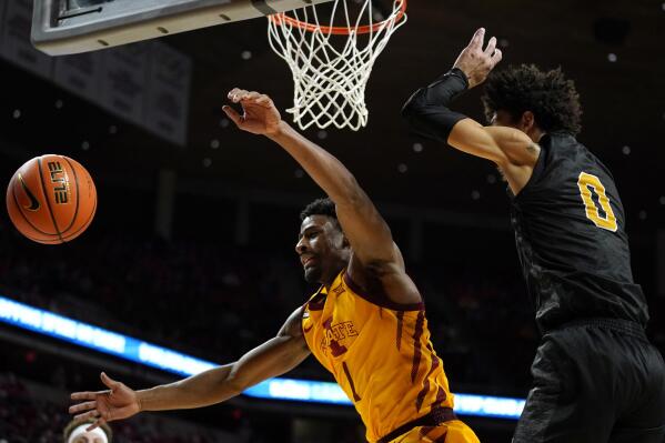 Iowa State guard Izaiah Brockington (1) fights for a rebound with Alabama State forward Trace Young (0) during the second half of an NCAA college basketball game, Tuesday, Nov. 16, 2021, in Ames, Iowa. (AP Photo/Charlie Neibergall)