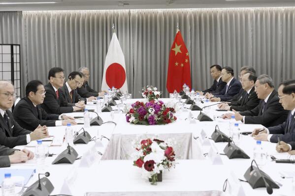 Japanese Prime Minister Fumio Kishida, third left, holds a meeting with Chinese Premier Li Qiang, third right, in Seoul, South Korea, Sunday, May 26, 2024. (Daisuke Suzuki/Kyodo News via AP)