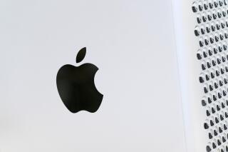 This May 21, 2021 photo shows the Apple logo displayed on a Mac Pro desktop computer  in New York.  Apple is planning to scan U.S. iPhones for images of child abuse, drawing applause from child protection groups but raising concern among security researchers that the system could be misused by governments looking to surveil their citizens.(AP Photo/Mark Lennihan)