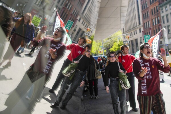 The New School students and pro-Palestinian supporters rally outside The New School University Center building, Monday, April 22, 2024, in New York. (AP Photo/Mary Altaffer)