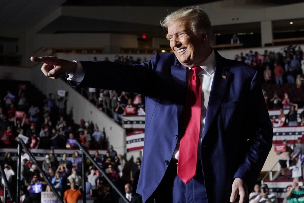 Republican presidential candidate former President Donald Trump gestures as he leaves a campaign rally Saturday, July 29, 2023, in Erie, Pa. (AP Photo/Sue Ogrocki)