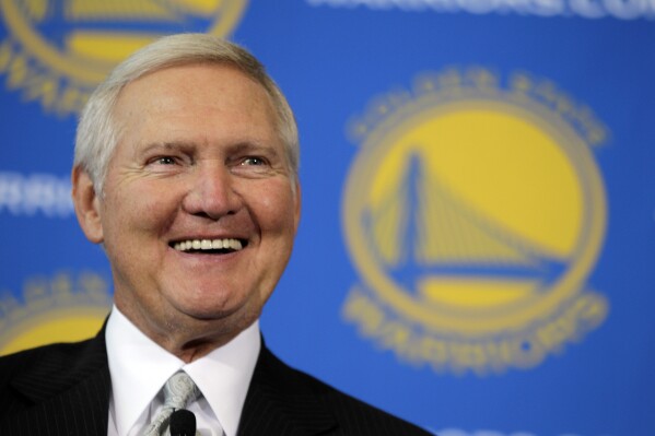 FILE - Jerry West smiles after being introduced as a new member of the Golden State Warriors basketball club's Executive Board, during a news conference in San Francisco, May 24, 2011. Jerry West, who was selected to the Basketball Hall of Fame three times in a legendary career as a player and executive and whose silhouette is considered to be the basis of the NBA logo, died Wednesday morning, June 12, 2024, the Los Angeles Clippers announced. He was 86. (AP Photo/Eric Risberg, File)