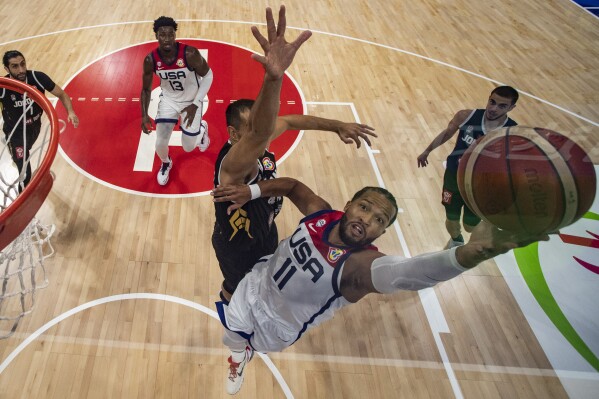 Team USA guard Jalen Brunson (11) goes to the basket during the Basketball World Cup Group C game between the United States and Jordan, Wednesday, Aug. 30, 2023, in Manila, Philippines. (AP Photo/Ezra Acayan, Pool)