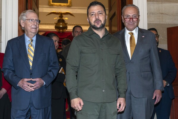 Ukrainian President Volodymyr Zelenskyy, center, with Senate Minority Leader Mitch McConnell, of Ky., left, and Senate Majority Leader Chuck Schumer of N.Y., right, speaks briefly to the media after meeting with members of Congress, Thursday, Sept. 21, 2023, at the Capitol in Washington. (AP Photo/Jacquelyn Martin)